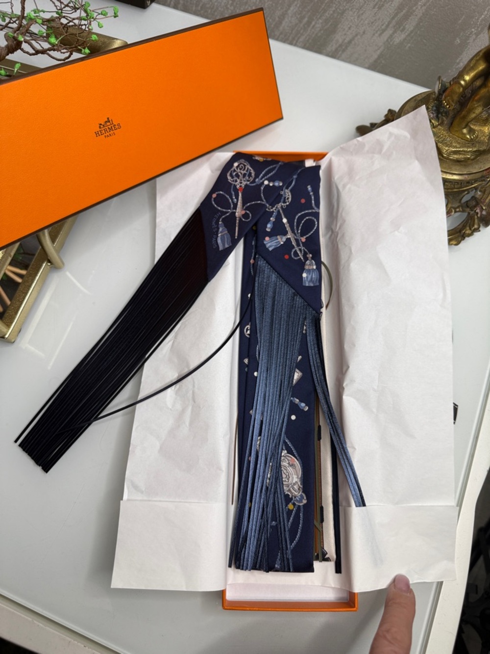 Hermes Navy Key & Chain Print Silk Twilly with leather Fringe comes with a box